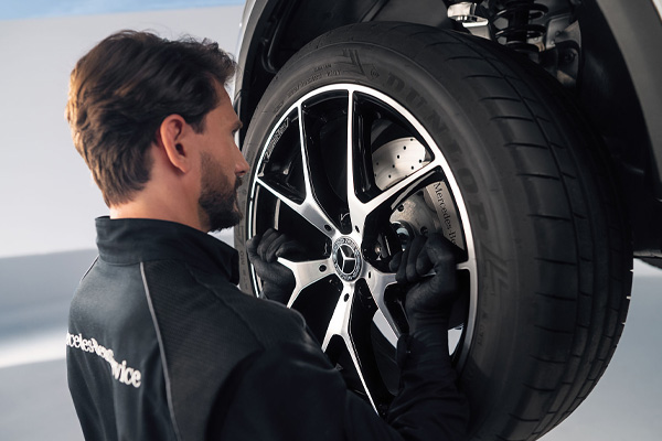 Mercedes-Benz mechanic replacing car wheel and tyre