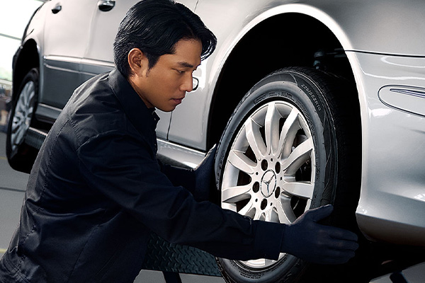Mercedes-Benz Technician fixing car brakes